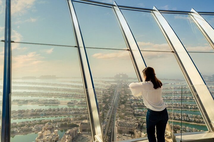 Experience breathtaking panoramic views from The View at The Palm Jumeirah where the stunning architecture and lush landscapes of Dubai unfold beneath you creating unforgettable memories.
